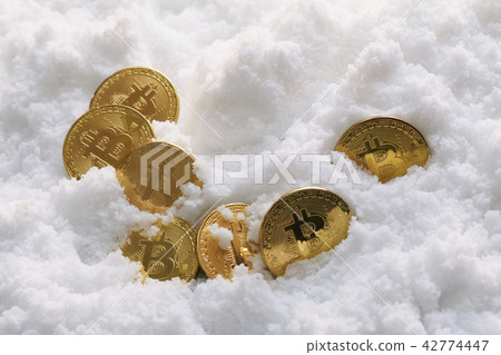 Bit coins buried in the snow 42774447