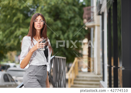 Portrait of stylish dressed young girl having big eyes and plump lips. 42774510