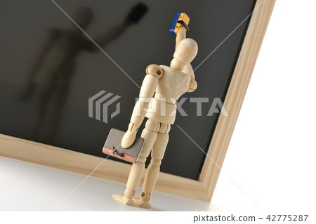 Teacher and blackboard 42775287