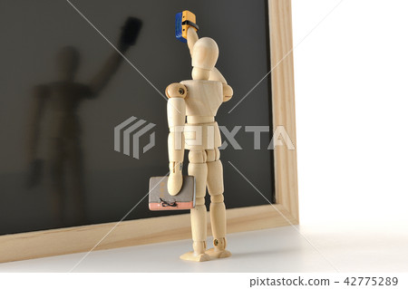 Teacher and blackboard 42775289