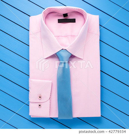 Pink shirt on blue wooden background 42779334