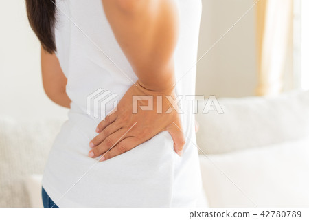 Close up woman having pain in injured back. Close up woman having pain in injured back. 42780789
