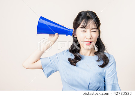 Woman with a loudspeaker Woman with a loudspeaker 42783523