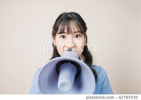 Woman with a loudspeaker Woman with a loudspeaker 42783550