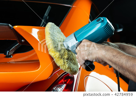 Car detailing series: Polishing orange sports car Car detailing series: Polishing orange sports car 42784959