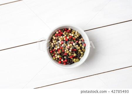 Colorful pepper in white bowl. Close up 42785493