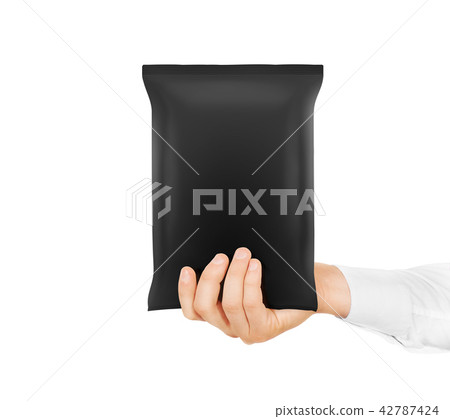 Blank black snack bag mock up hold in hand isolated. Blank black snack bag mock up hold in hand isolated. 42787424
