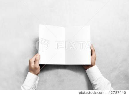 Hand opening blank white brochure booklet mockup. 42787440