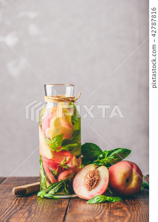 Detox Water with Peach and Basil. 42787816