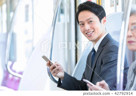 Businessman who commutes to train Mid-level employee business image Businessman who commutes to train Mid-level employee business image 42792914