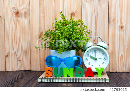 SUNDAY letters text and notebook paper, clock 42795015