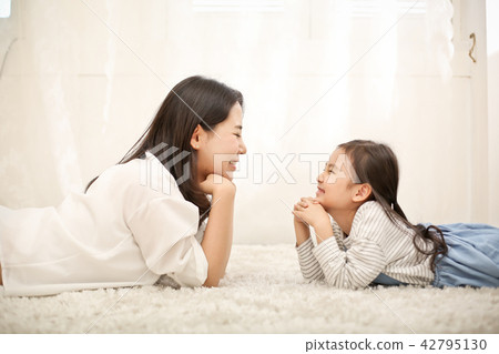 Mom and child facing each other Mom and child facing each other 42795130