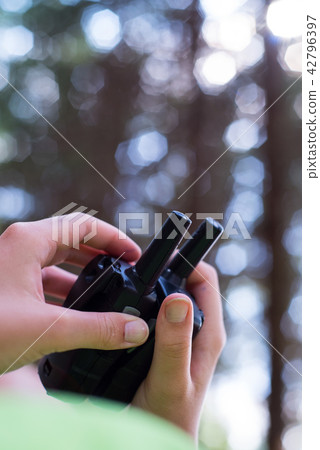 Transmitters in hand. Transmitters in hand. 42796397