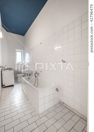 old white tiled bathroom with bathtub - renovation 42796479