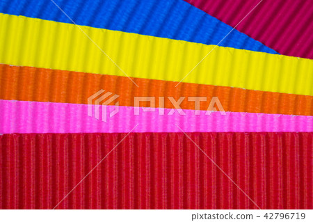 Multi coloured corrugated paper texture 42796719