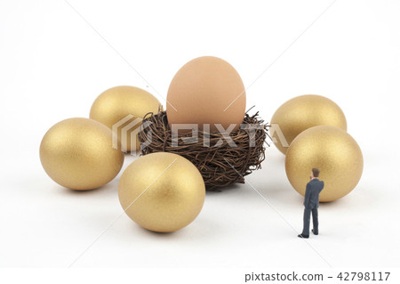 Businessman with golden egg and egg 42798117