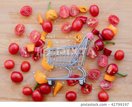 cut yellow and red peppers with tomatoes cut yellow and red peppers with tomatoes 42799197