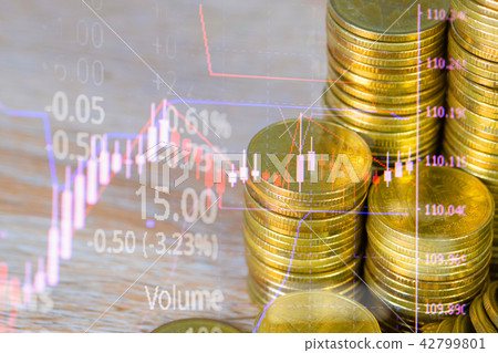 coin stack with stock market screen candle stick 42799801