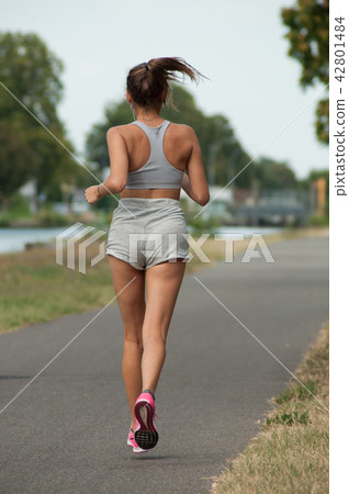 sexy girl  running in border channel 42801484