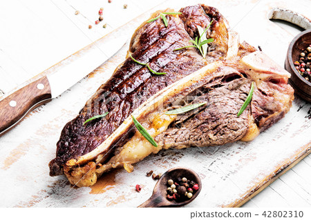 Sirloin steak on cutting board 42802310