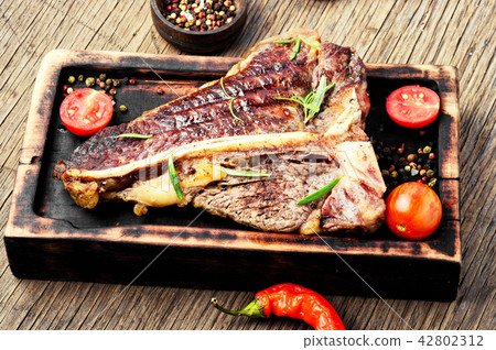 Sirloin steak on cutting board Sirloin steak on cutting board 42802312