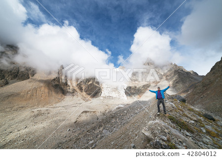 Tourist in the mountains 42804012