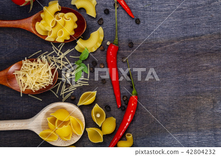 Different pasta in spoons Different pasta in spoons 42804232