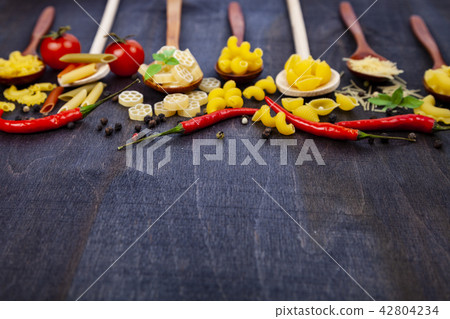 Different pasta in spoons Different pasta in spoons 42804234