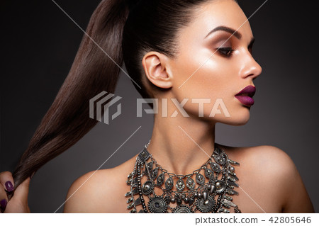 Beauty Brunette Woman with Perfect Makeup. Beautiful Professional Holiday Make-up. 42805646