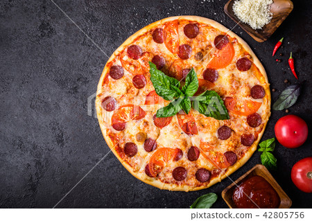 Pizza pereroni and ingredients on black background Pizza pereroni and ingredients on black background 42805756