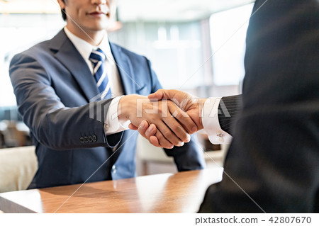 Businessman shaking hands Businessman shaking hands 42807670