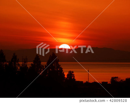 Sea, mountain, and sunset 42809328