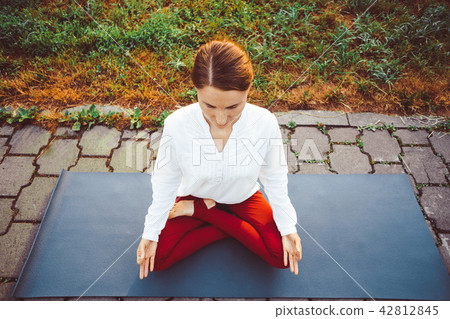 girl doing yoga outdoors girl doing yoga outdoors 42812845
