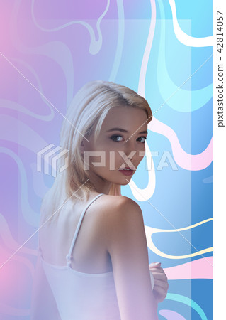 Young woman looking at her haircut while visiting her hairdresser 42814057
