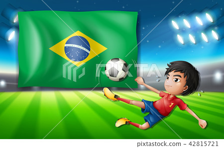Boy soccer player infront of brazil flag 42815721