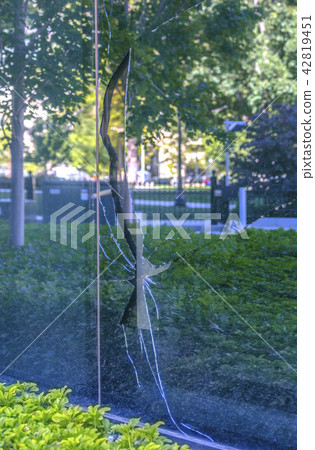 Broken glass panel window on a business building 42819451