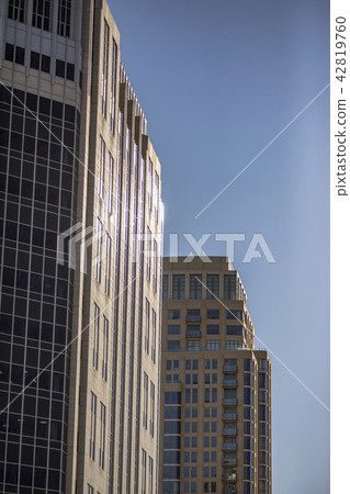 High rise buildings with sun reflection downtown High rise buildings with sun reflection downtown 42819760