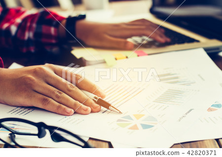 Business woman working at office with laptop 42820371