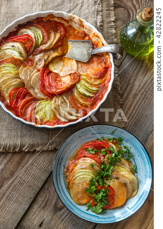 Dish of ratatouille on the wooden table Dish of ratatouille on the wooden table 42822245