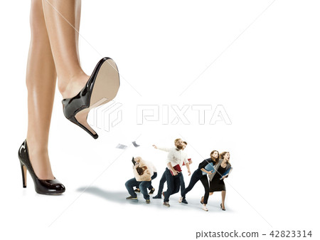 Scared and shocked team of young business men and women under lady boss pressure 42823314