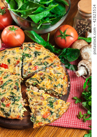Frittata made of eggs, mushrooms and spinach Frittata made of eggs, mushrooms and spinach 42823514
