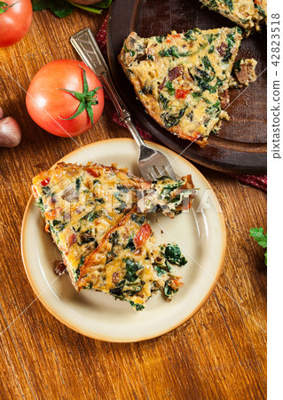 Portion of frittata made of eggs and mushrooms Portion of frittata made of eggs and mushrooms 42823518