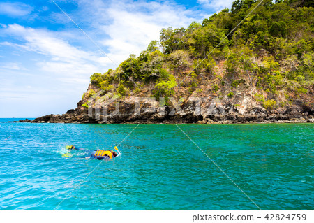 Tourist woman snorkeling in tropical island in Thailand. 42824759