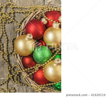Christmas balls red, gold, green, beads lie in a Christmas balls red, gold, green, beads lie in a 42826519