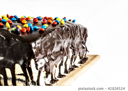 the cake watered chocolate and sprinkle with  42826524