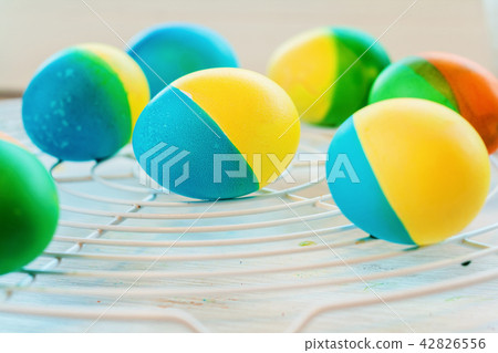 Easter eggs painted by hand yellow and blue lie 42826556