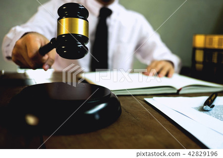 Judge with gavel on table. attorney, court judge. 42829196