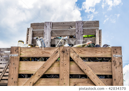 Empty wine bottles stacked in wine boxes 42834370