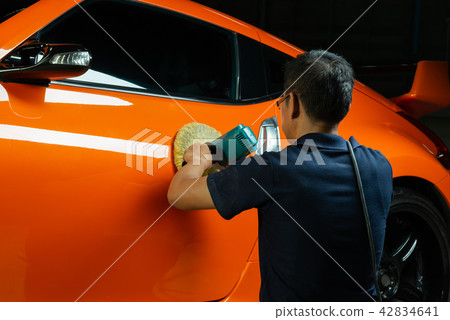 Car detailing series: Polishing orange sports car 42834641