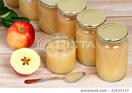 Homemade preserved apple puree in jars 42835337